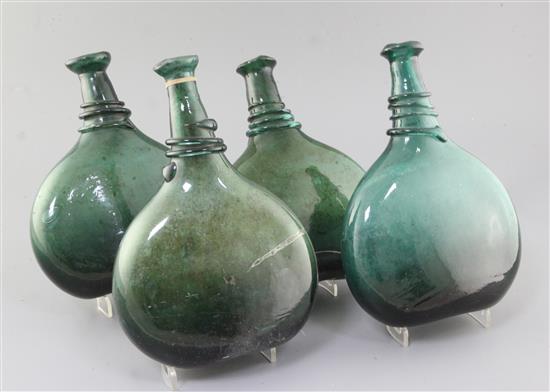 Four Persian green glass saddle flasks, 18th/19th century, 23cm - 25.5cm